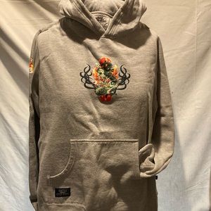 Grey unisex hoodie with graphic design.